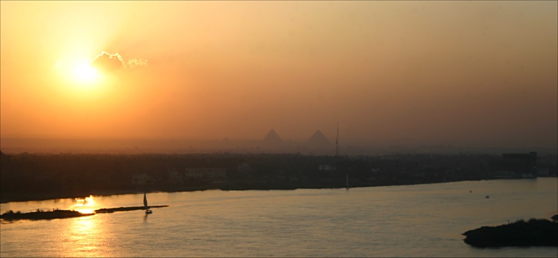  Nile, Cairo and Pyramids in setting sun