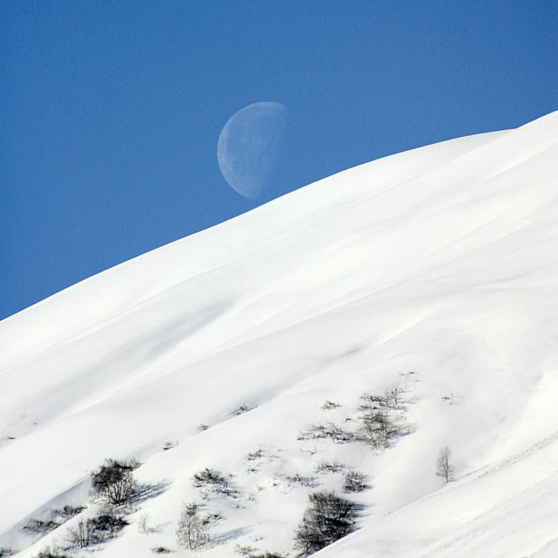 Moon setting over french Alps